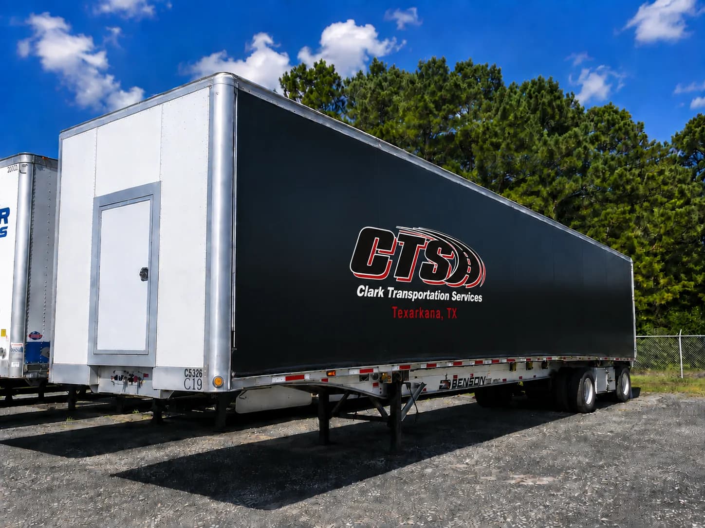 Black CTS branded Conestoga trailer at the Texarkana yard